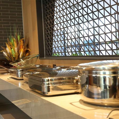 Qiu Guo Hotel Hua Mao Chaoyang  Esterno foto